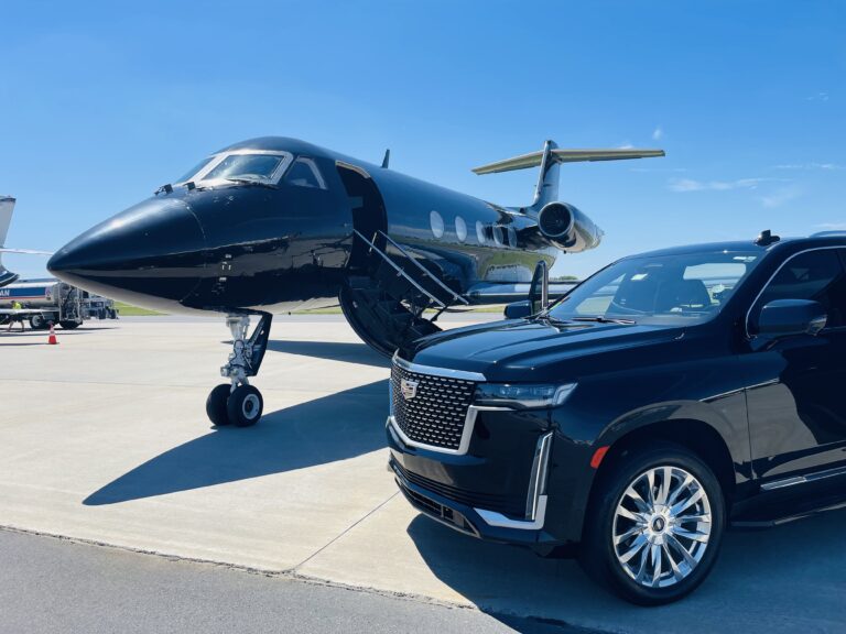 Luxury black Cadillac Escalade parked next to a private jet at the airport, showcasing Duke Limo’s premium airport car service in Mooresville, NC.